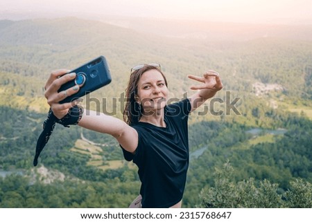 Girl travel blogger takes selfie photos for her social network followers