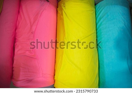 Artistic variety of shade tone colors Textile Fabrics rolls stacked pattern texture