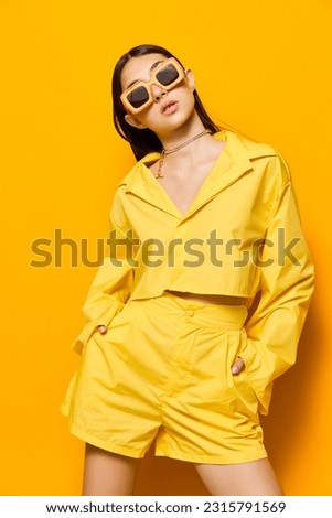 young woman beautiful dance girl fashion yellow sunglasses trendy attractive lifestyle Royalty-Free Stock Photo #2315791569