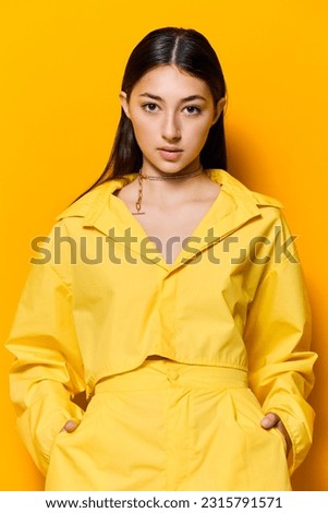 woman young attractive beautiful trendy lifestyle fashion outfit girl model yellow Royalty-Free Stock Photo #2315791571