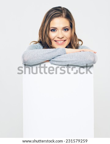 smiling woman hold white banner. isolated portrait. studio background.
