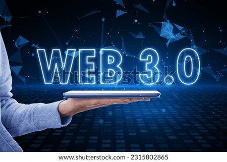Future of the Internet, blockchain, computing and meta concept with glowing web 3.0 sign above human hand with digital tablet on blue technological background