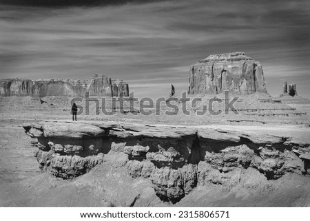 Amazing rock formations in the Monument Valley, Navajo Tribal Park, Utah, USA. Dry landscape. Black and white photography.