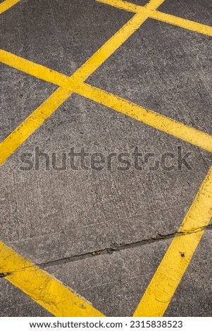 yellow road grid painted on the floor 