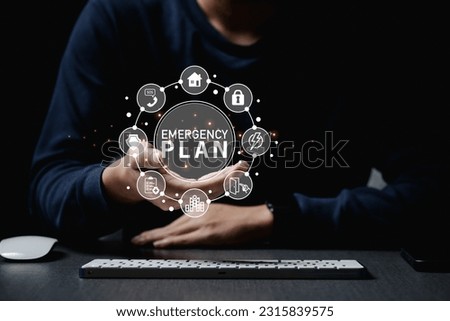 Business Evacuation Training concept. Concept of Emergency Preparedness Plan.Businessman touching Emergency Plan icon to learn and prepare in emergency situation Royalty-Free Stock Photo #2315839575