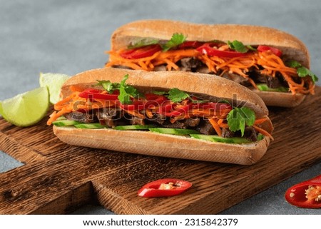 Banh mi. Vietnamese sandwich close-up, side view, selective focus. Royalty-Free Stock Photo #2315842379