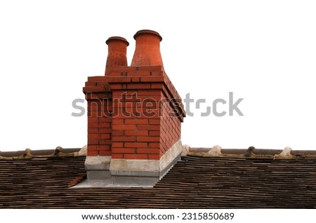 Roof of old French house with flat tiles and red brick chimneys isolated on the white background