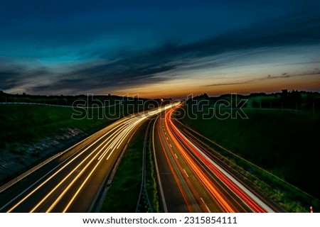 lights of cars driving at night. long exposure Royalty-Free Stock Photo #2315854111