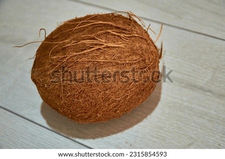 Fresh coconut on a white wooden background