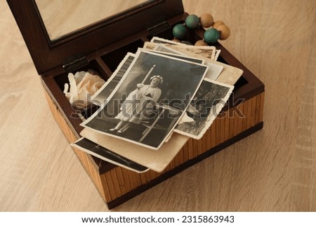 old photographs 1930, dear to heart memorabilia in vintage wooden box, stack of retro photos, vintage photographs, concept family tree, genealogy, memories, home archive, keep as keepsake