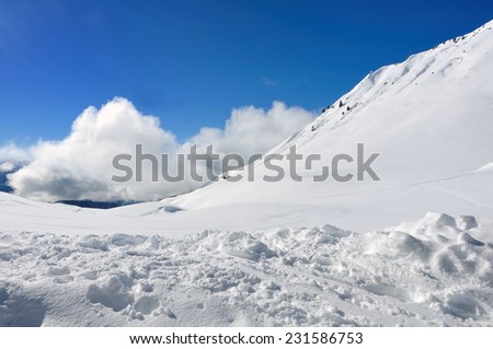 white clouds in blue sky in mountain snowy