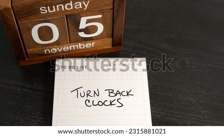 Note of reminder to turn back clocks for the end of Daylight Saving Time on Sunday, November 5, 2023.                               Royalty-Free Stock Photo #2315881021