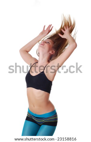 Beautiful young sports woman doing gymnastics exercises