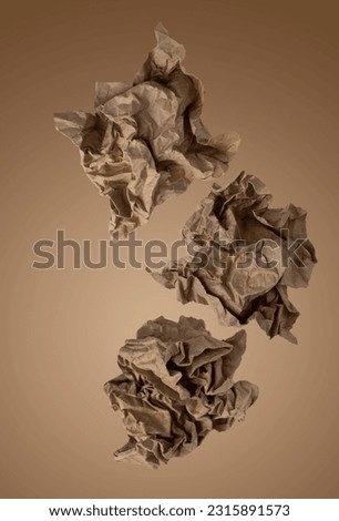 crumpled kraft paper flies on a beige background, abstract texture background, creative photo