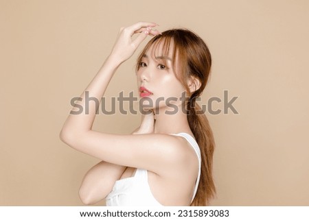 Young Asian beauty woman model pony tail hair with korean makeup style on face and perfect skin on isolated beige background. Facial treatment, Cosmetology, Spa, Aesthetic, plastic surgery.