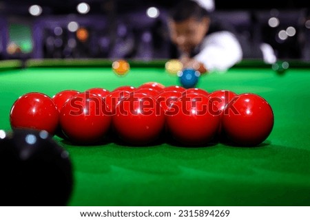 Snooker red ball group set with snooker player blur in background while aiming red ball on snooker table. Royalty-Free Stock Photo #2315894269