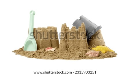 Beautiful sand castles, shells and plastic beach toys isolated on white Royalty-Free Stock Photo #2315903251