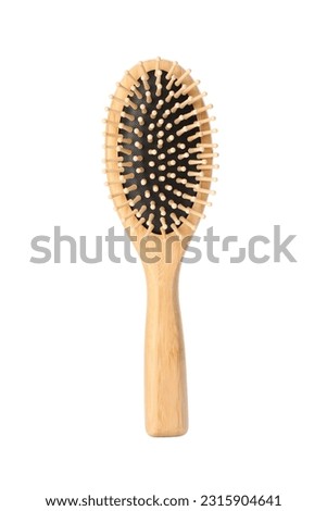 One new wooden hairbrush isolated on white Royalty-Free Stock Photo #2315904641