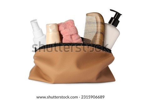 Preparation for spa. Compact toiletry bag with different cosmetic products isolated on white Royalty-Free Stock Photo #2315906689