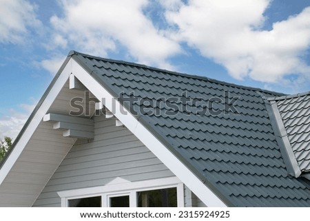 Metal tile.Roof for the house. Modern coatings for the roof of the house. Royalty-Free Stock Photo #2315924925