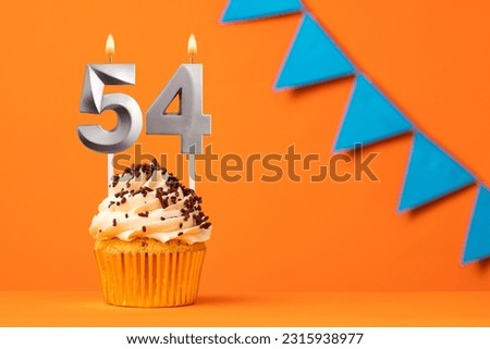 Birthday cake with candle number 54 - Orange background
