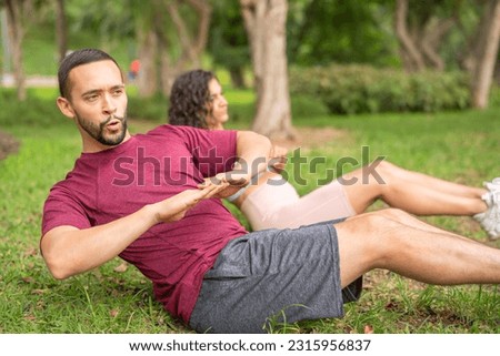 Man and woman training in the park