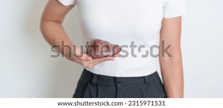 Woman holding human Liver anatomy model. Liver cancer and Tumor, Jaundice, Viral Hepatitis A, B, C, D, E, Cirrhosis, Failure, Enlarged, Hepatic Encephalopathy, Ascites Fluid in Belly and health Royalty-Free Stock Photo #2315971531