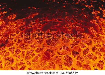 Volcano lava eruption background, landscape ground is full of lava. Royalty-Free Stock Photo #2315985559
