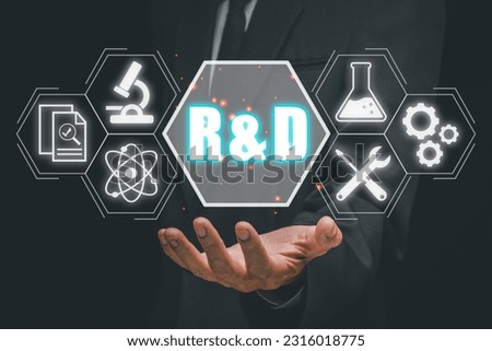 Research and development concept, Business person hand holding esearch and development icon on virtual screen.