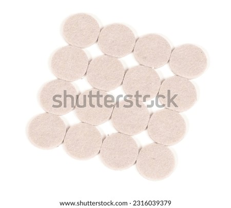 New felt adhesive furniture pads, isolated on white