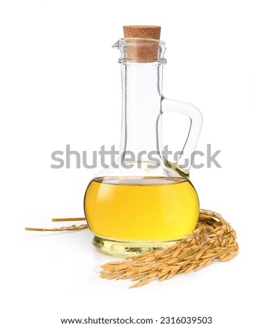 Rice bran oil extract with paddy unmilled rice isolated on white background. Royalty-Free Stock Photo #2316039503