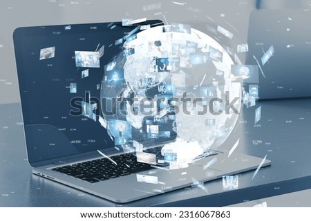 Close up of laptop with creative globe with telecommunication picture icons on blurry office workplace background. Business, video conference, remote group work. Double exposure