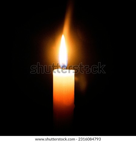 candles in the dark, flame of a candle burning in the dark Royalty-Free Stock Photo #2316084793