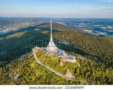 Sunny evening at Jested Mountain with unique building on the summit. Liberec, Czech Republic. Aerial view from drone.