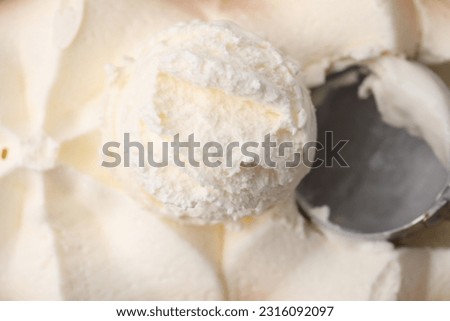 Scoop of delicious vanilla ice cream as background, closeup