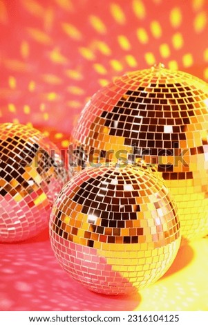 Many shiny disco balls on pink background
