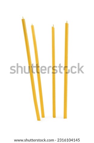 Many new church candles on white background