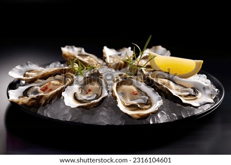 Platter of fresh oysters on a bed of ice. Oysters with lemon and sauce. Several oysters on a tray with caviar. Food in a restaurant. A bowl of oysters with caviar.  Royalty-Free Stock Photo #2316104601