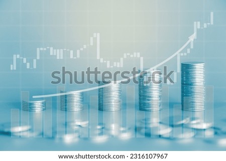 Stack of money coin with trading graph and up curve arrow. Business and finance background with blue filter.