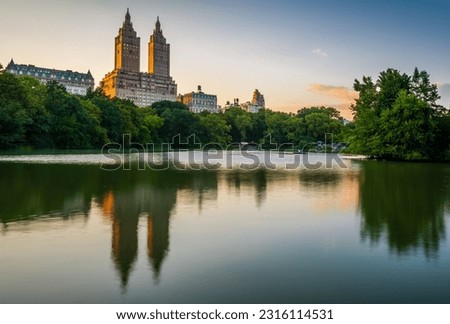 The Lake in the Central Park in New York City with the reflection of The San Remo apartment building in dusk. 