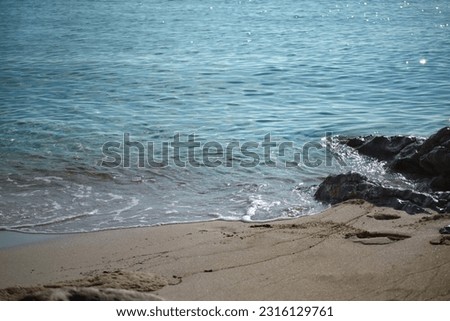 beautiful quiet little bay by the sea of Spain, island, blue water, little waves