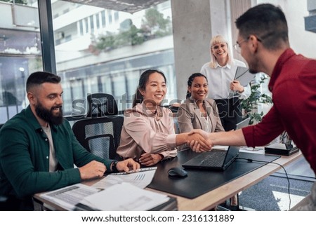 Human resource team talking to a candidate during a job interview in the office. Royalty-Free Stock Photo #2316131889