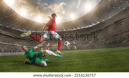 Professional male sportsmen, football, soccer athletes during game at 3D stadium with flashlights. Blurred audience on background. Concept of professional sport, championship, game, achievement