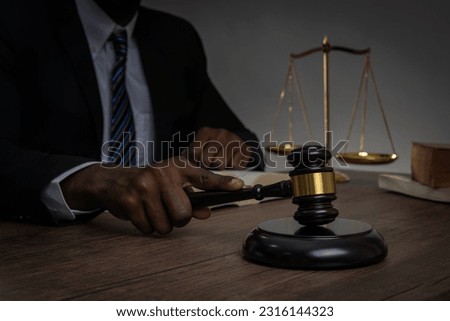 Lawyer working  in courtroom.  Court of Law and Justice Trial Session.  Business Man n courtroom. Royalty-Free Stock Photo #2316144323