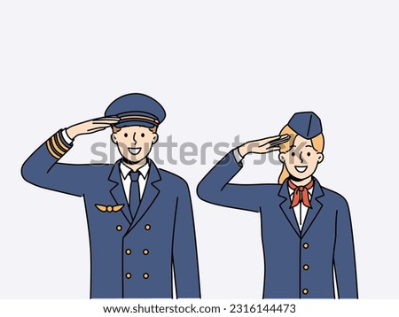 Pilot of aircraft and stewardess greet passengers of flight and thank you for using services of airline. Crew of aircraft from pilot with stewardess in service uniform smiling looking at screen Royalty-Free Stock Photo #2316144473