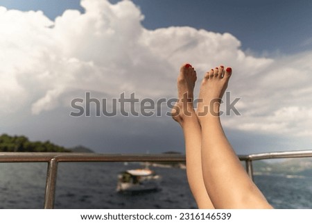  feet on the beach in a boat