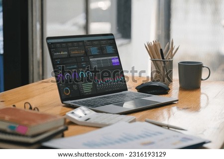 Business data analysis software on a dashboard screen. The investment application displays business sales and profits on the computer screen, providing advice for marketing planning decisions Royalty-Free Stock Photo #2316193129