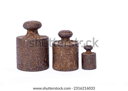 Vintage iron weights on the white background. Royalty-Free Stock Photo #2316216033