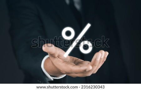 Concept of financial interest rates and dividends provision of financial services.Businessman showing percentage icons and up arrow icons. Interest Rates Stocks Finance Ratings Mortgage Rates.	