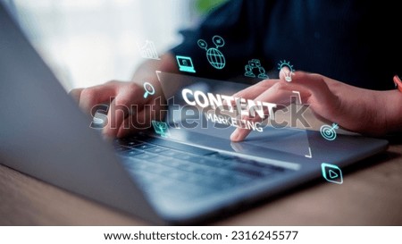 Content marketing concept with a woman working on a laptop on a futuristic virtual interface screen. Royalty-Free Stock Photo #2316245577